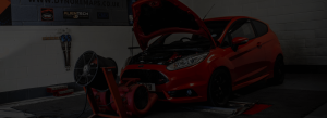 Red Car with Bonnet up on Dyno